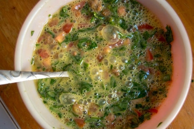 eggs in a bowl with spinach