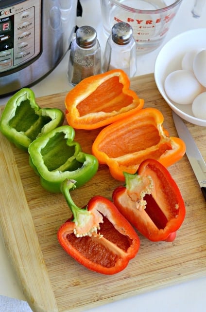 peppers cut in half on a cutting board