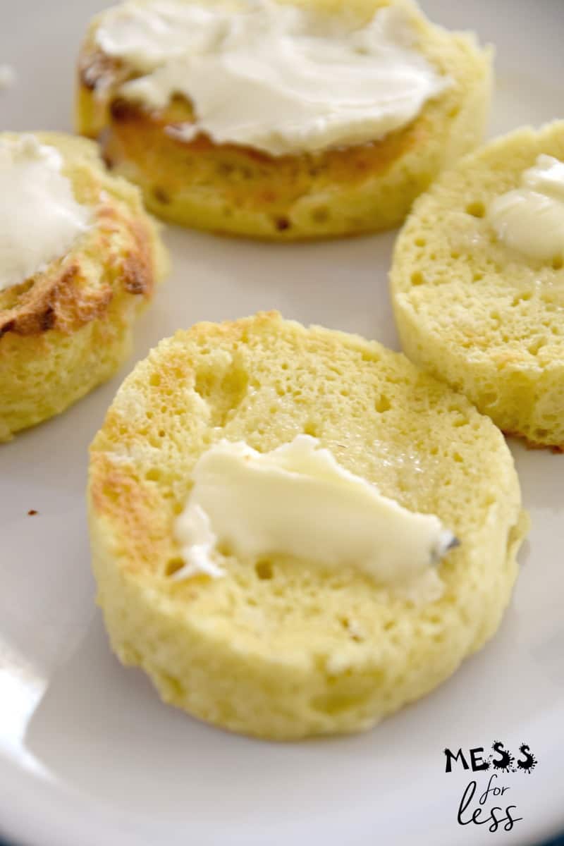 slices of keto bread in a mug with butter and cream cheese