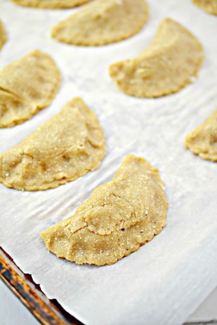 empanadas on a baking sheet