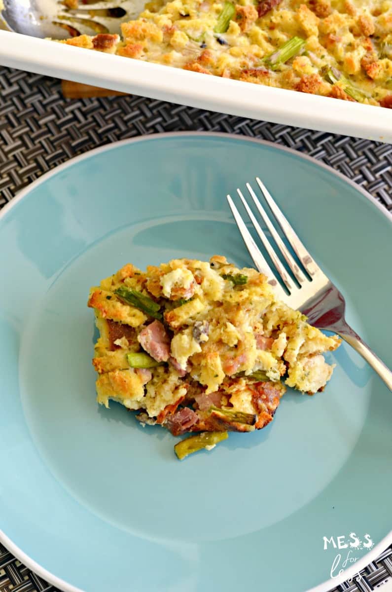 ham and asparagus casserole recipe with fork and blue plate