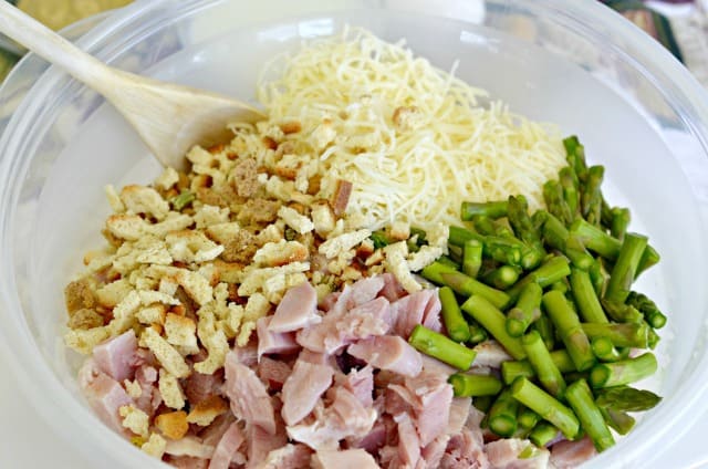 stuffing mix, ham, asparagus and cheese in a bowl