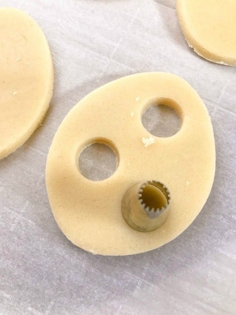 cutting holes in cookie dough