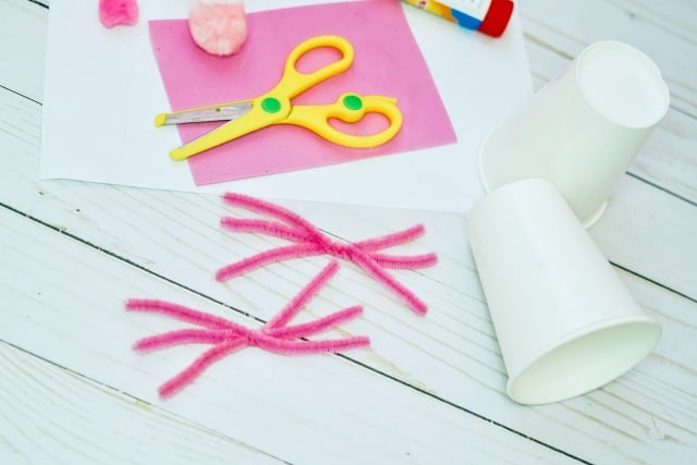 pink pipe cleaners and white cups