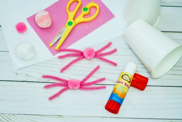 pink pom pom on pink pipe cleaners