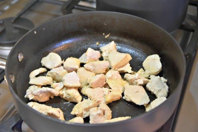 chicken cooking in a pan