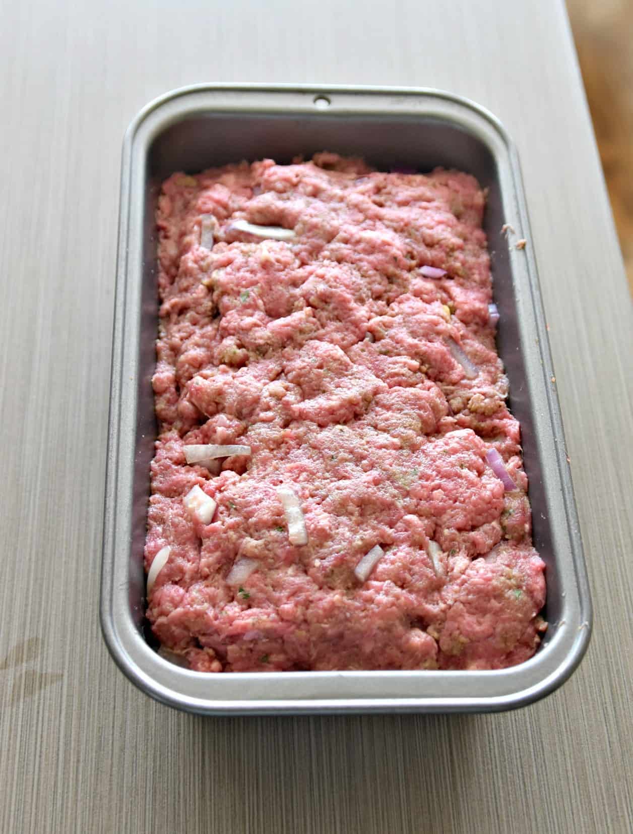 uncooked meatloaf in a loaf pan