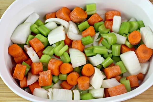 celery carrots and onions in a casserole dish