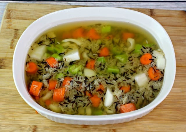 celery carrots onions and rice in a casserole dish