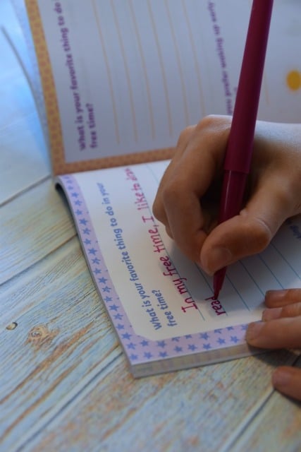 child writing in grateful together