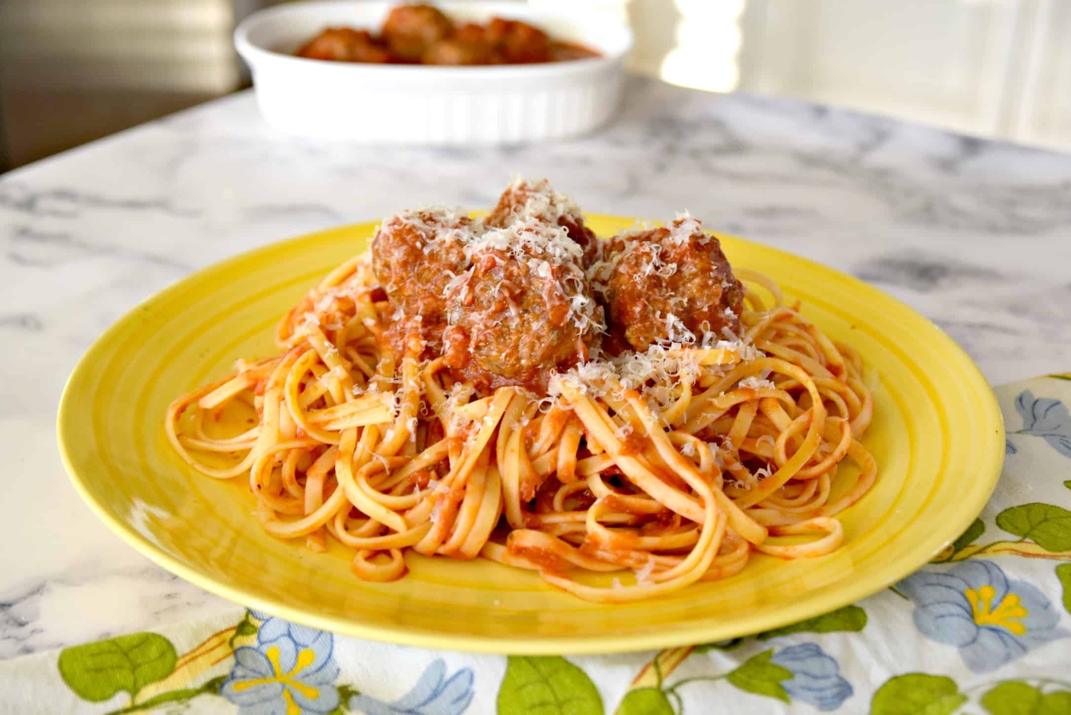 spaghetti and meatballs with Parmesan cheese