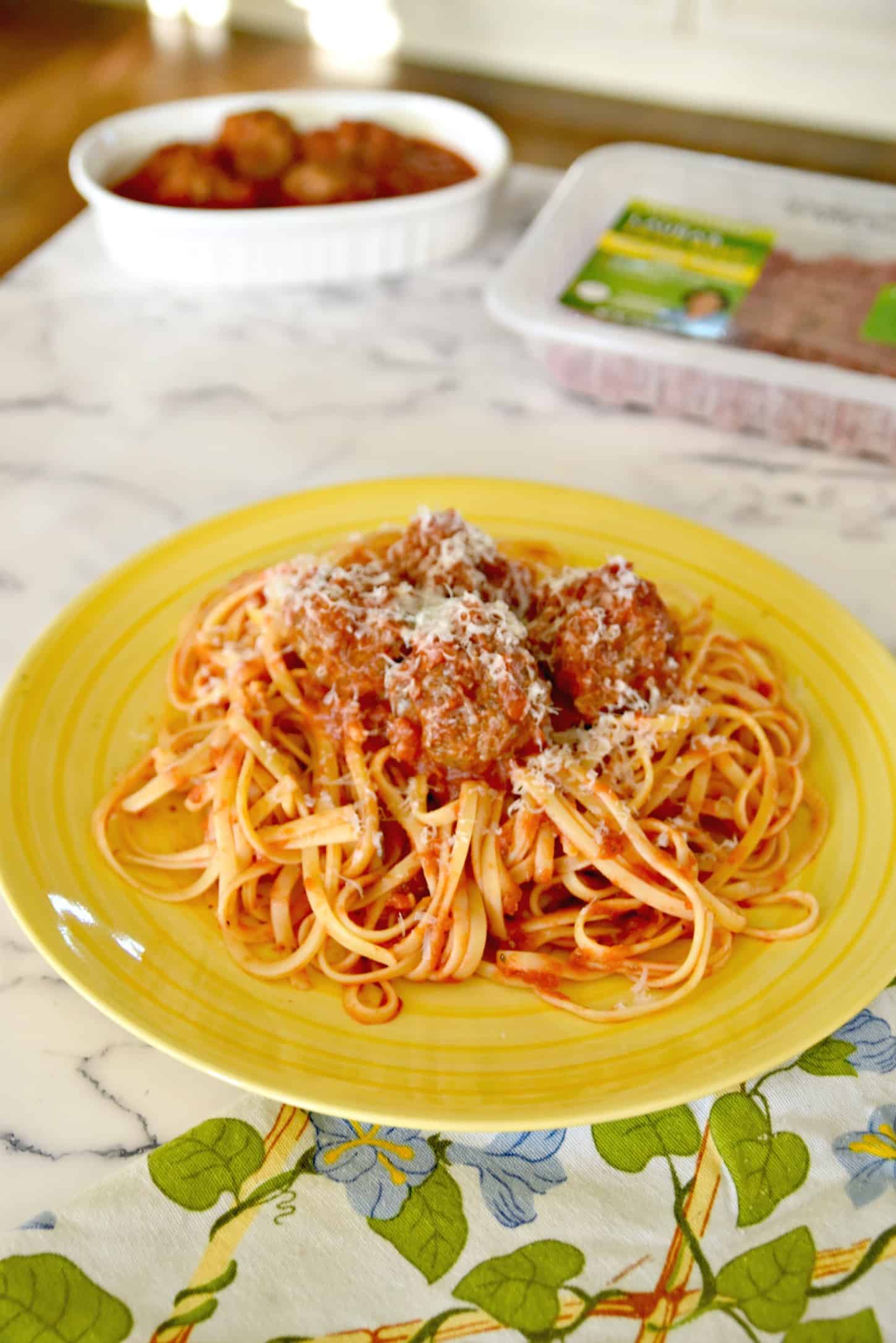 spaghetti and meatballs with Parmesan cheese