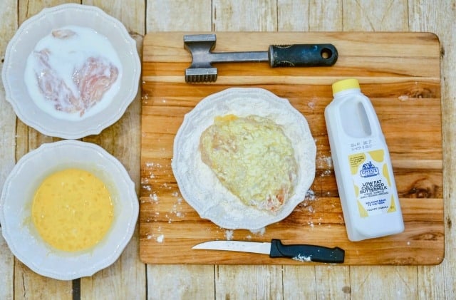 preparing fried chicken sandwich