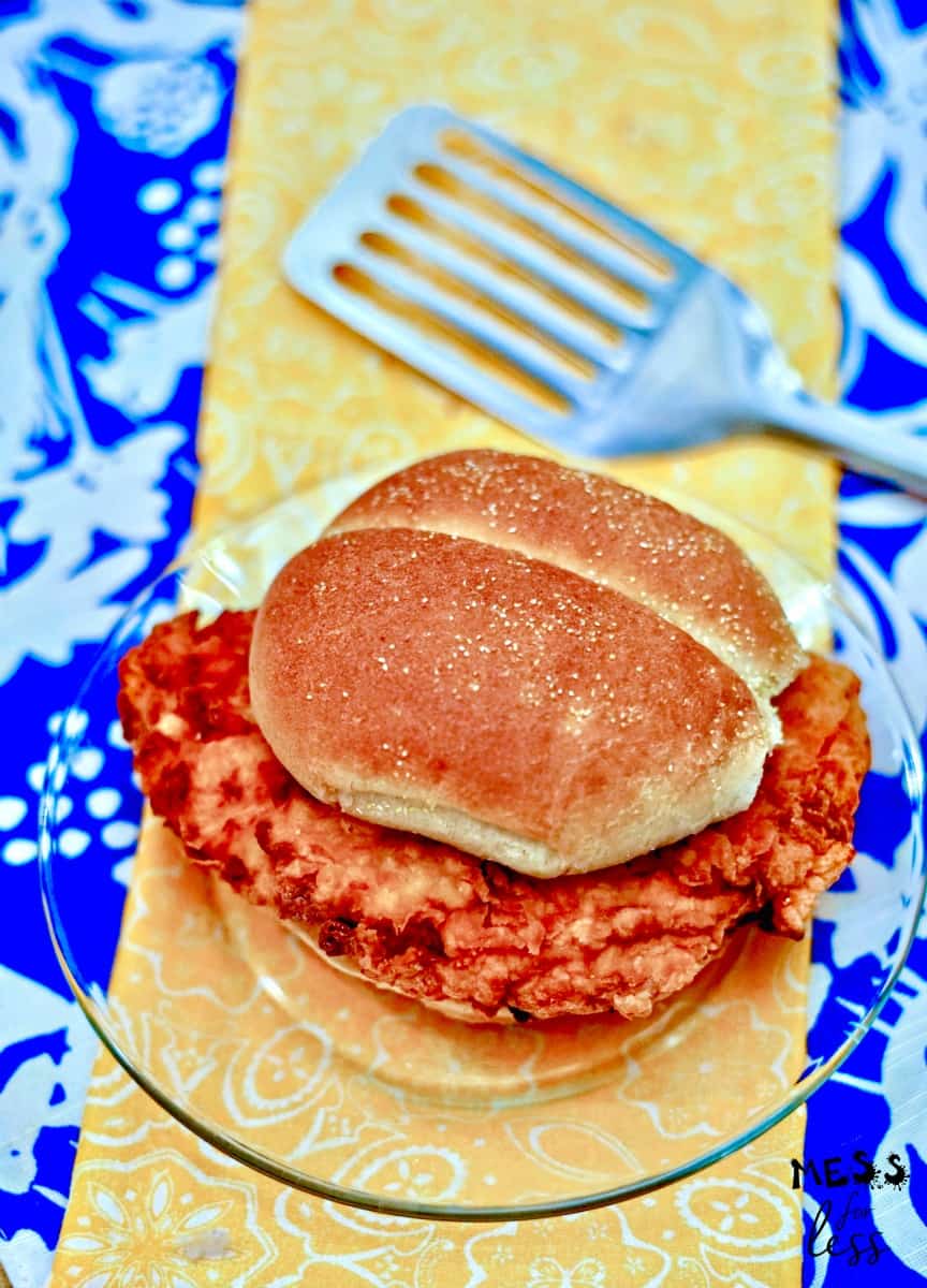 crispy buttermilk fried chicken sandwich on plate with spatula