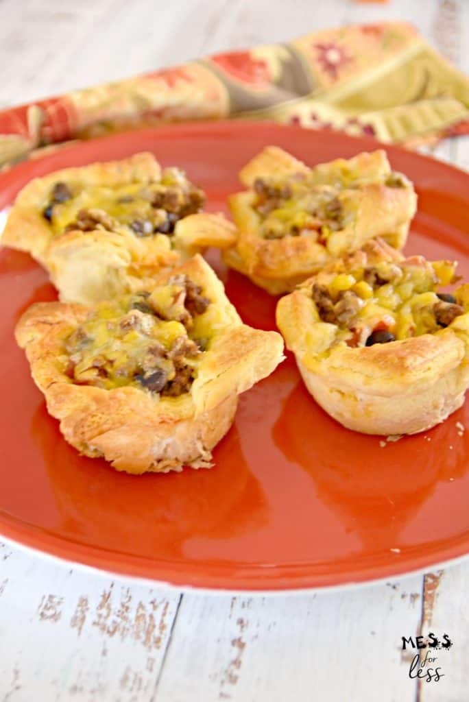 cheesy beef taco crescent cups on a red plate