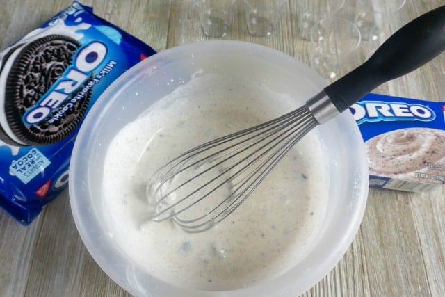 mixing oreo pudding in a bowl