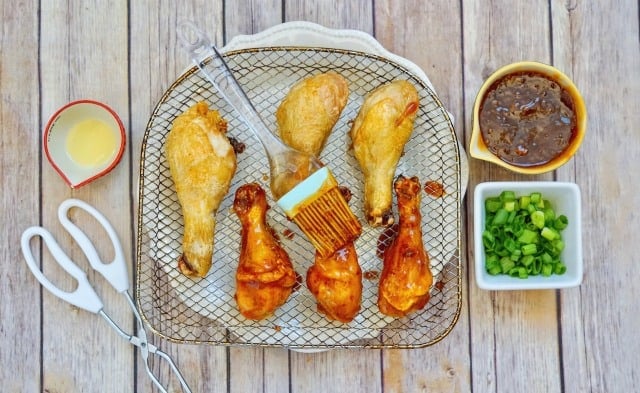 basting chicken drumsticks with teriyaki sauce