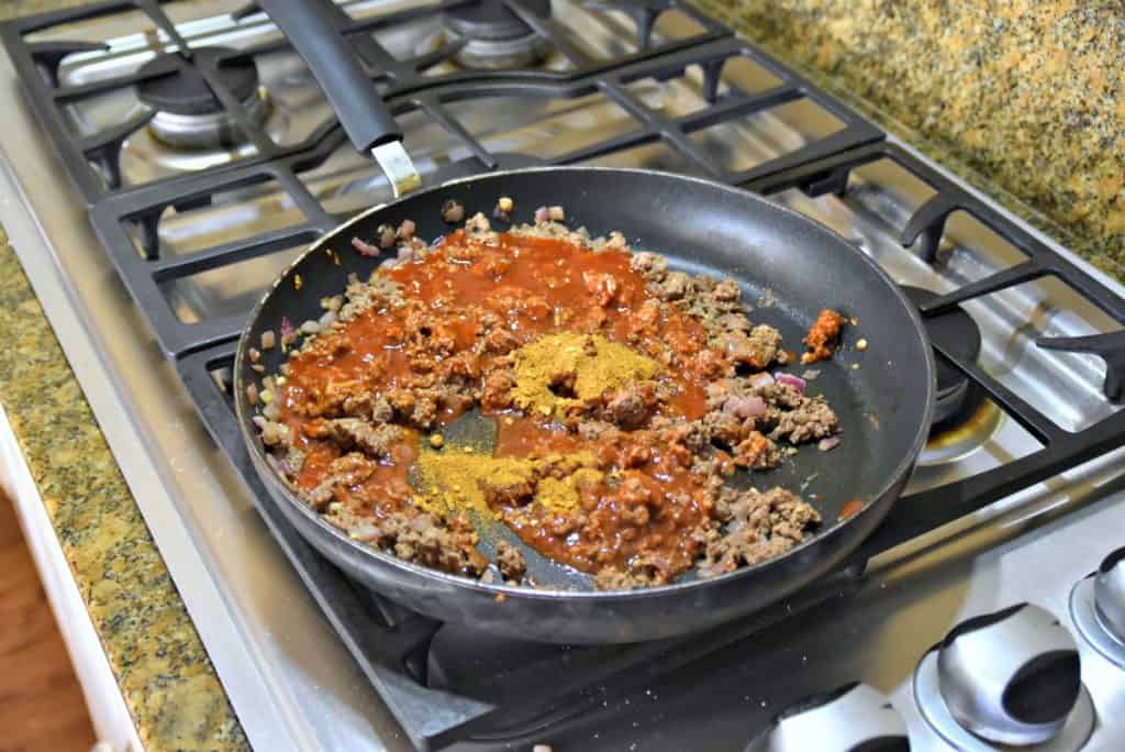 cooking ground beef with enchilada sauce