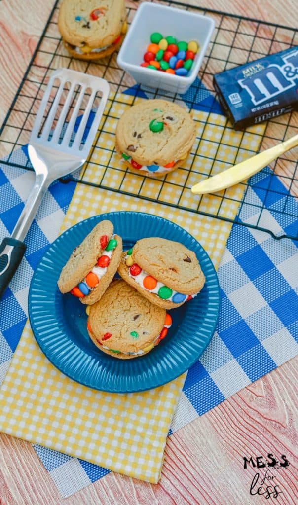 m&m cookie sandwiches on a blue plate