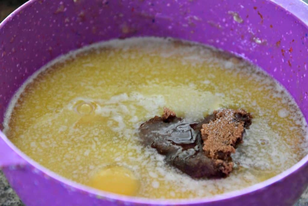 melted butter, eggs and sugar in a bowl