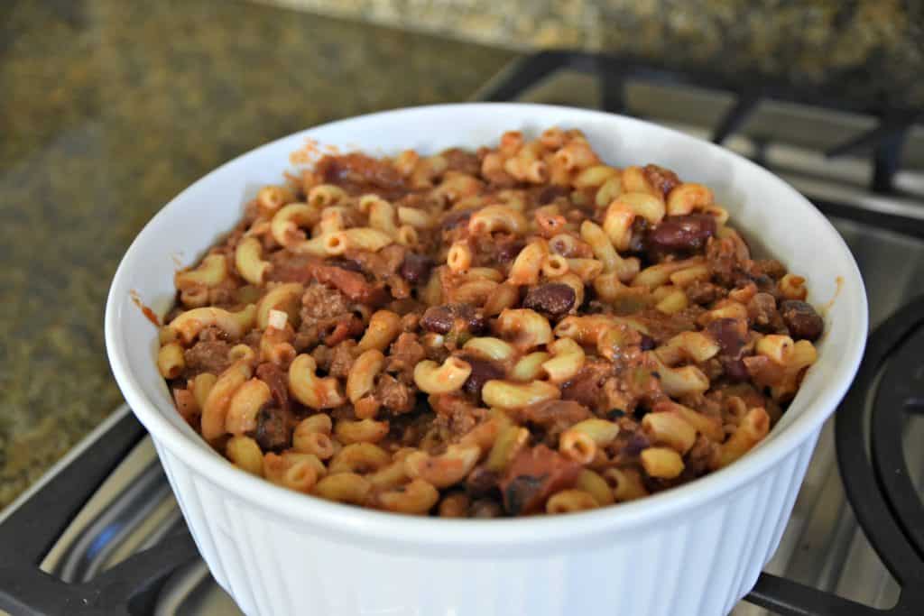 chili mac and cheese in a white casserole dish