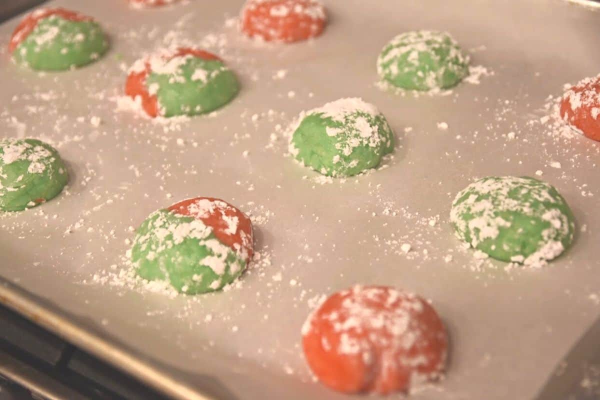 red and green cookie dough on baking sheet.