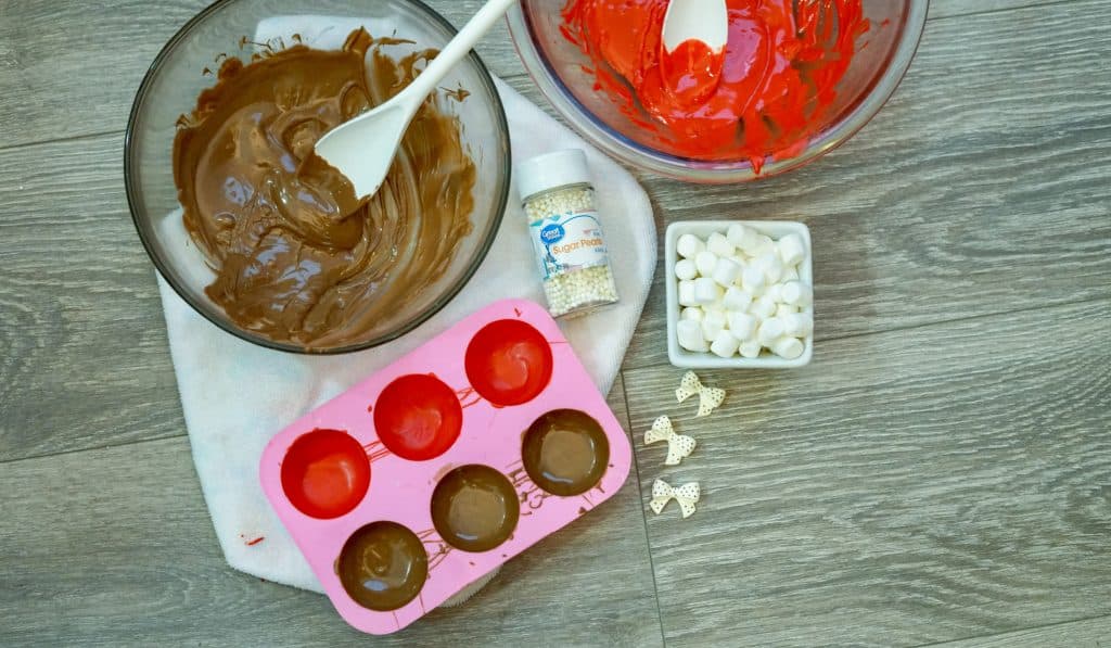 melted candy melts and hot cocoa bomb molds