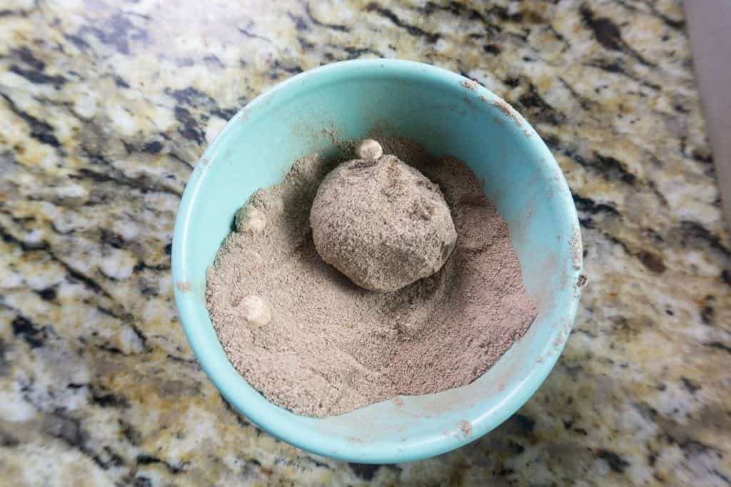 rolling truffle in hot chocolate powder