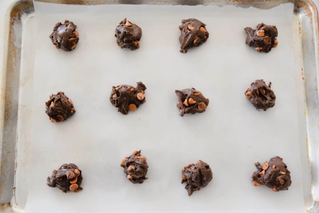 chocolate butterscotch cookies on a baking sheet