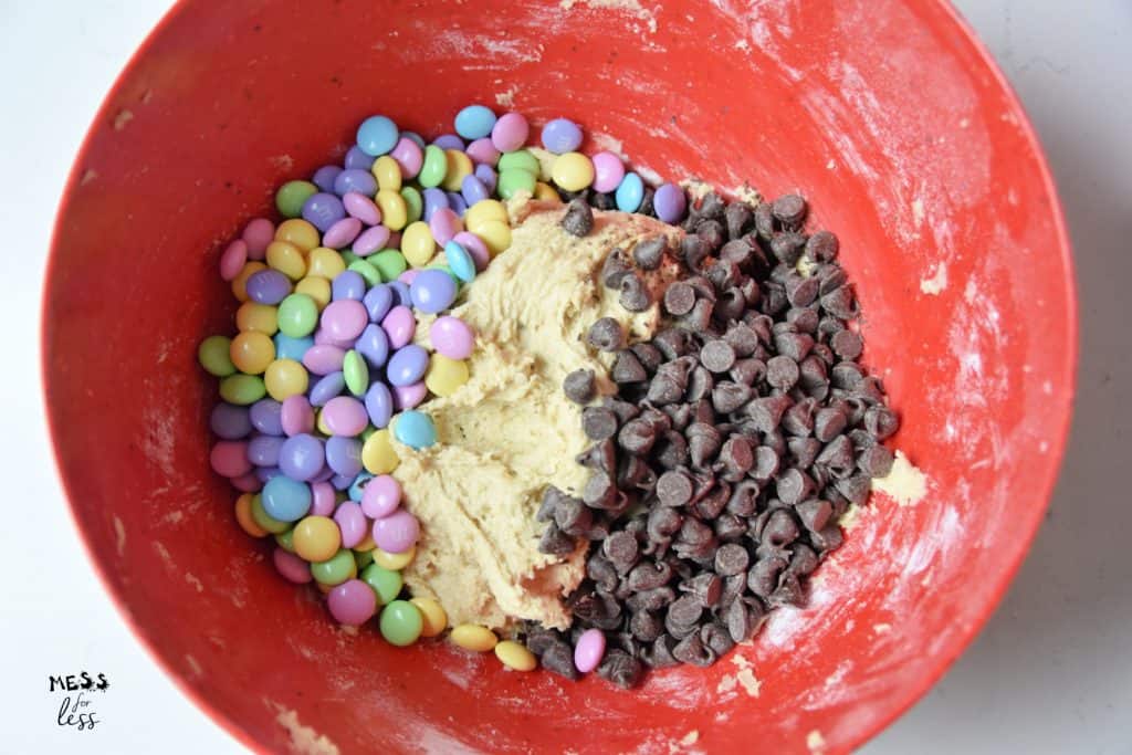 cookie batter m&Ms and chocolate chips in a bowl