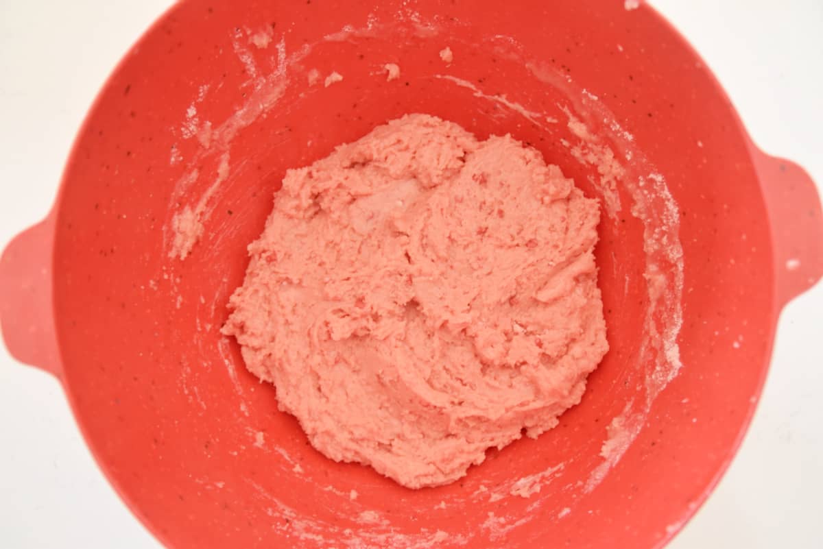 cake mix dough in a red bowl