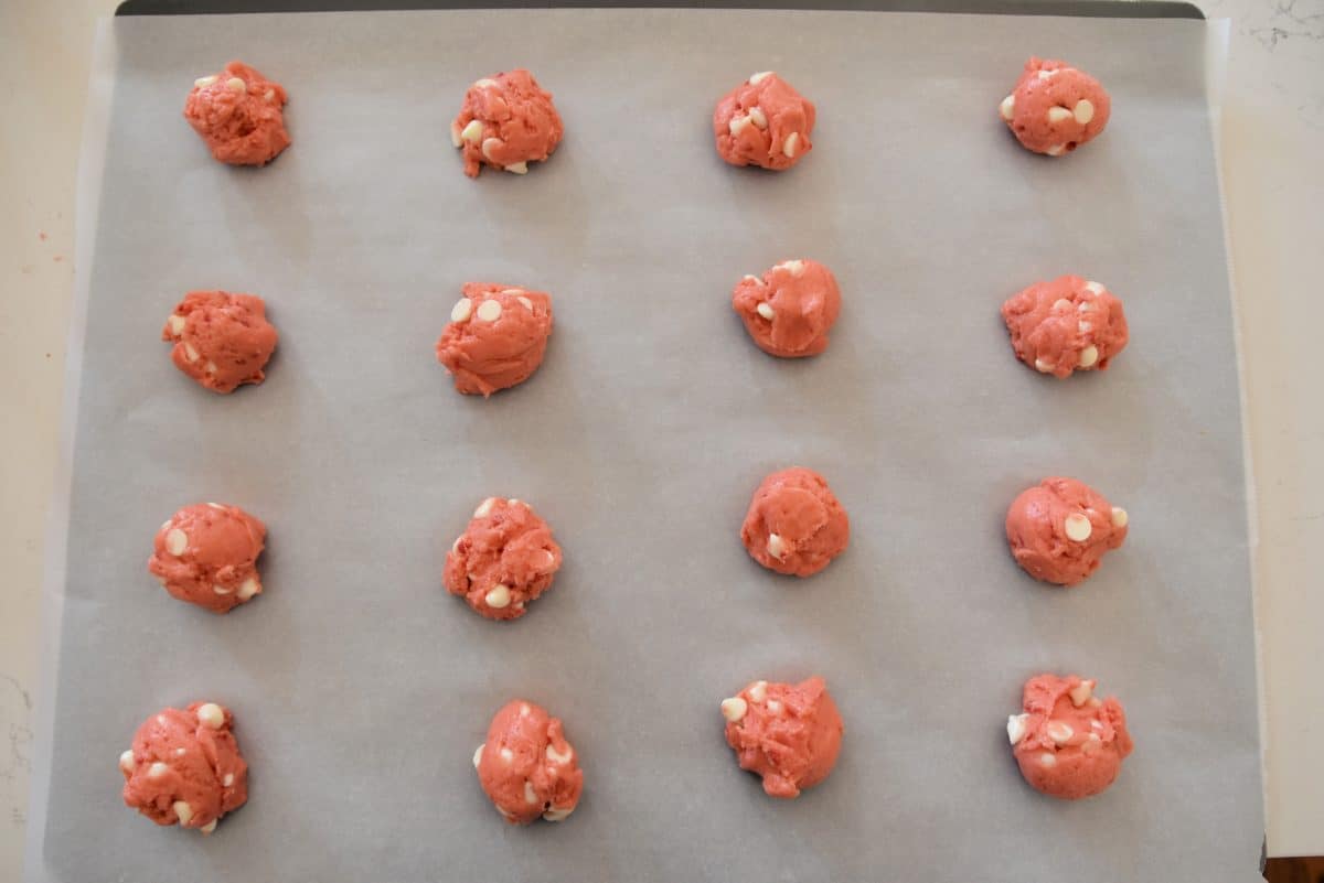 strawberry white chocolate chip cookie dough on a cookie sheet