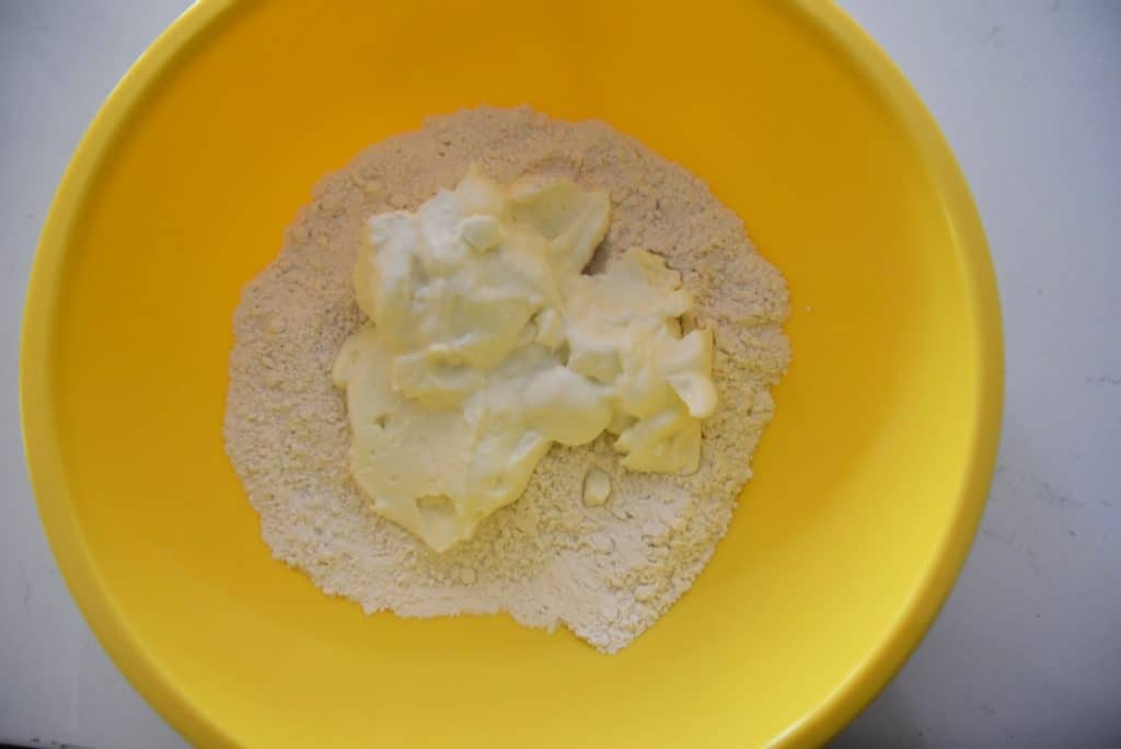 flour and yogurt in a yellow bowl