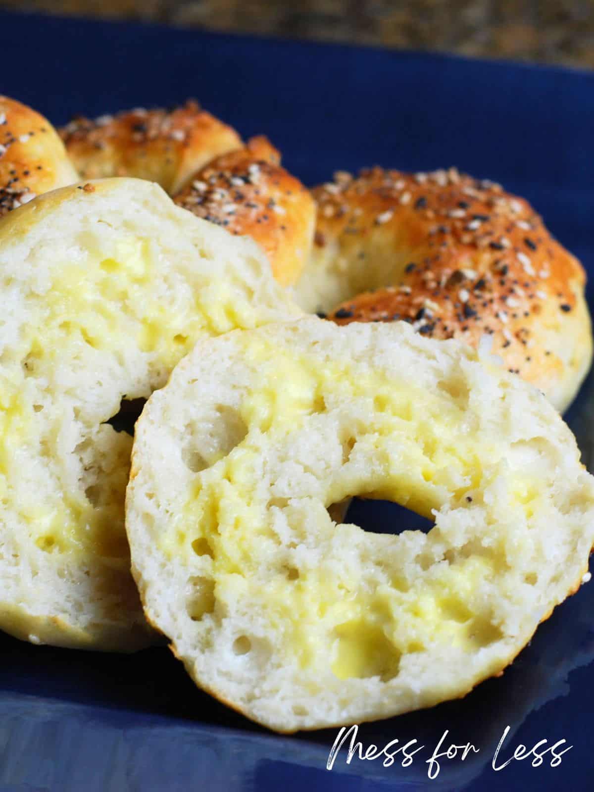 sliced bagel with butter