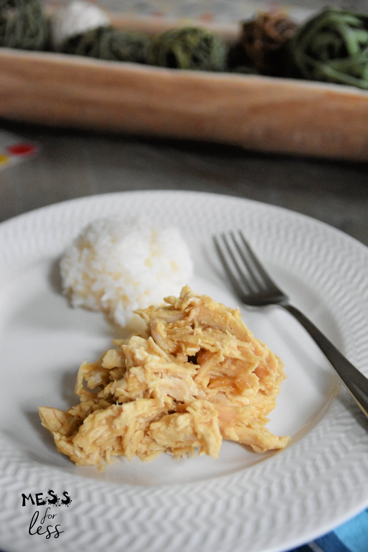 shredded chicken on white plate with rice