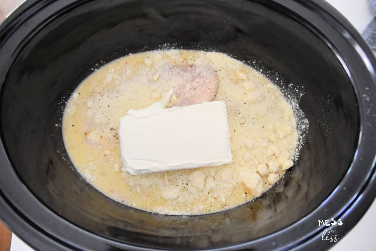 chicken in a crock pot with olive garden dressing and parmesan cheese and cream cheese