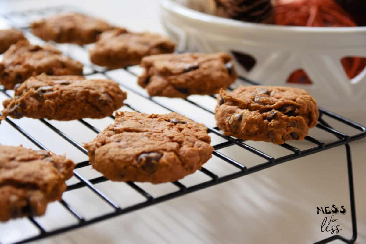 pumpkin spice cookies with chocolate chips on cooling rack