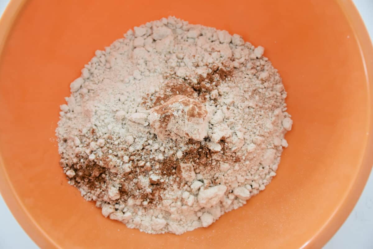 spice cake mix and pumpkin pie spice in a large bowl