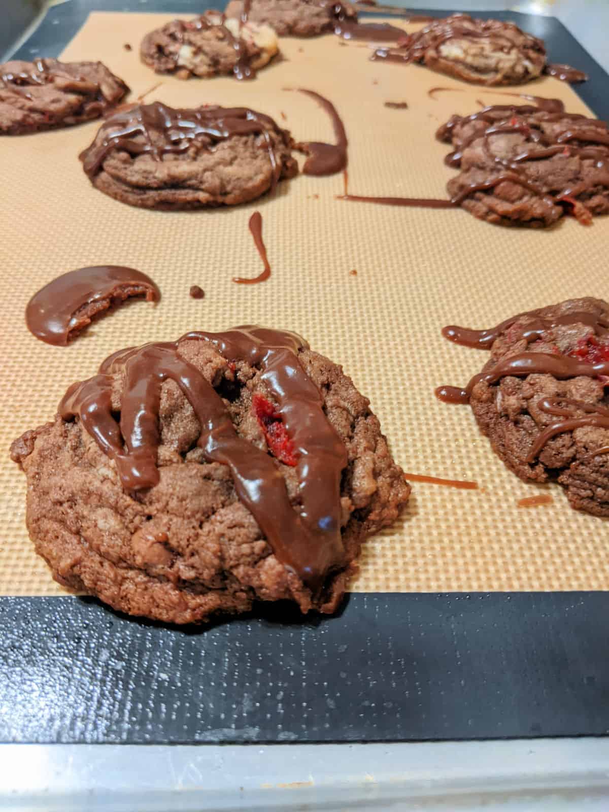 chocolate cookies with a chocolate glaze on a cookie sheet