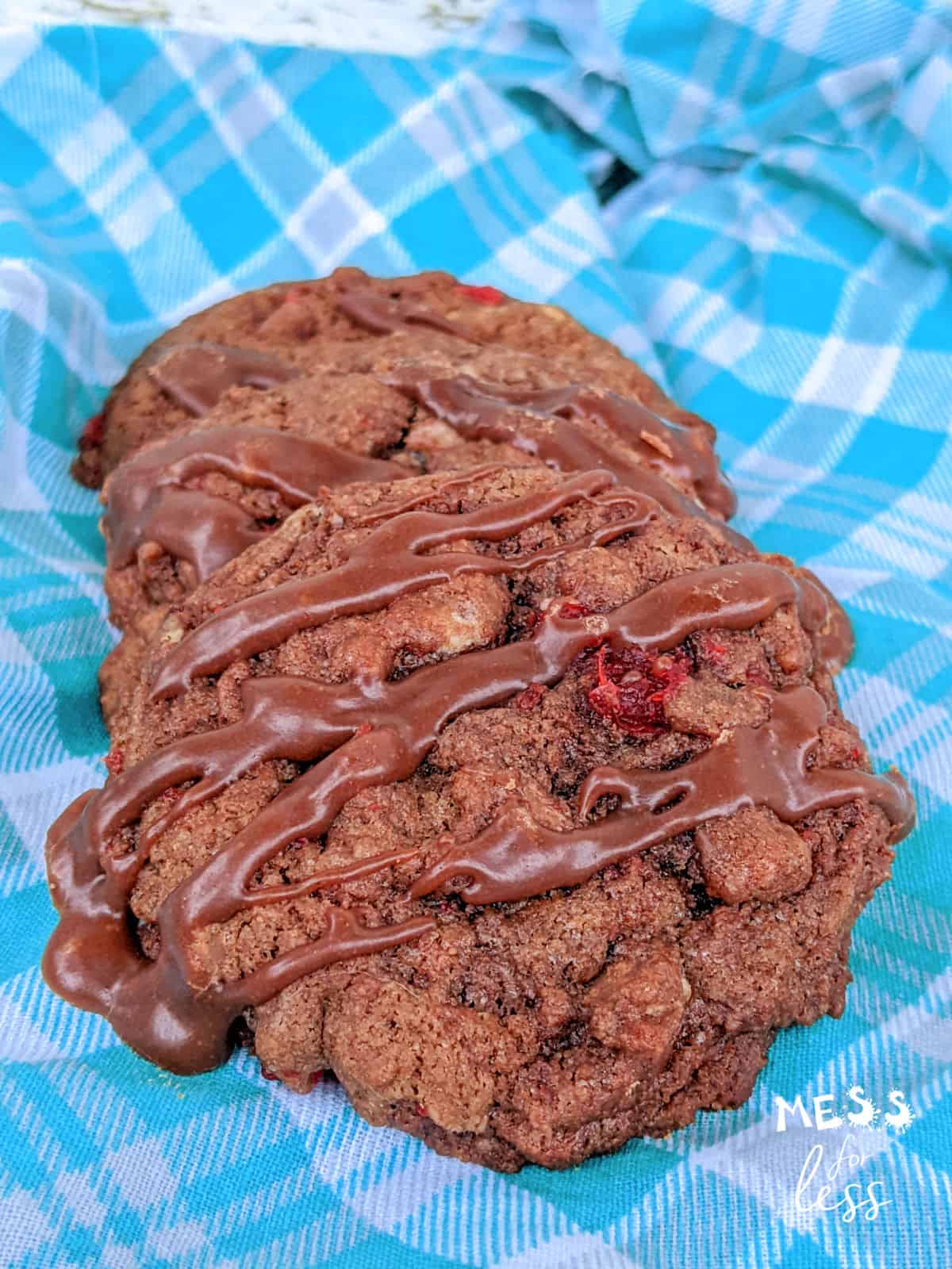 chocolate covered cherry cookies on a blue napkin