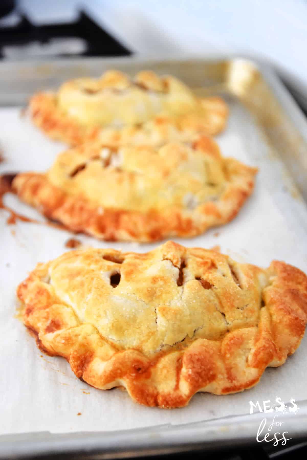 apple turnovers on a cookie sheet