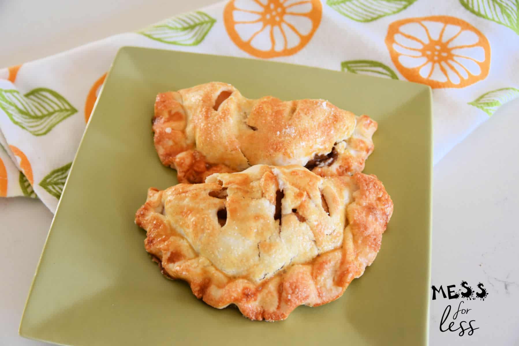 apple hand pies on a green square plate