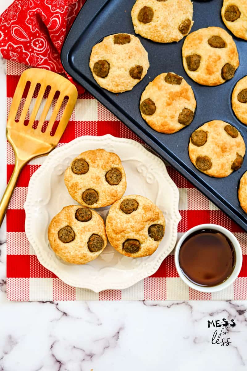 pancake muffins in a muffin tin with maple syrup