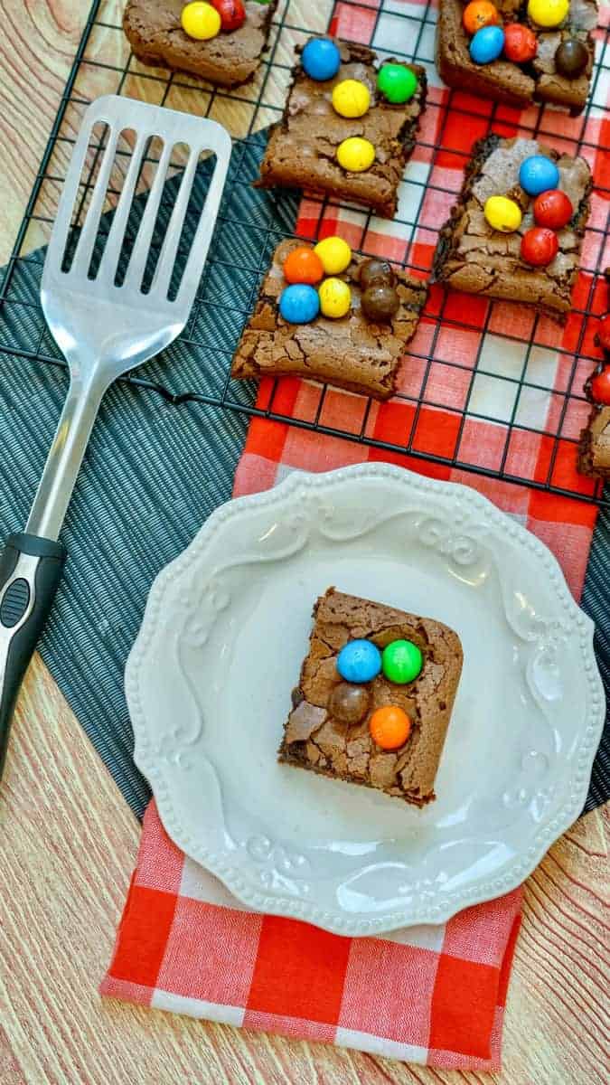 m&m brownies on plate and in pan