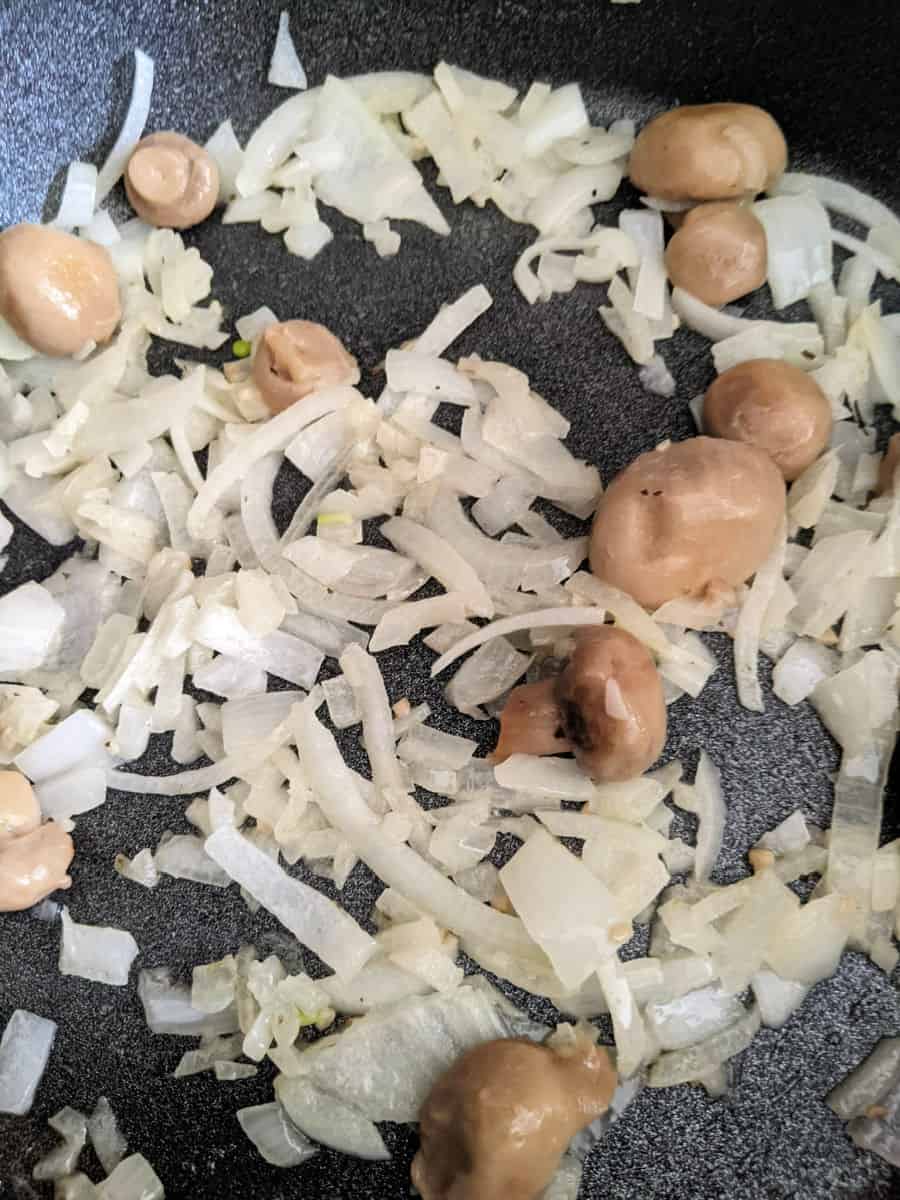 onions and mushrooms in pan