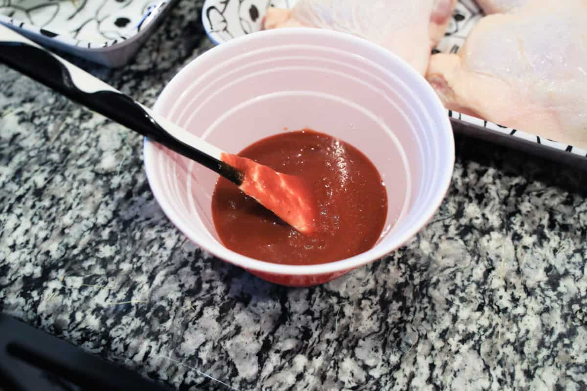 bbq sauce in cup with brush