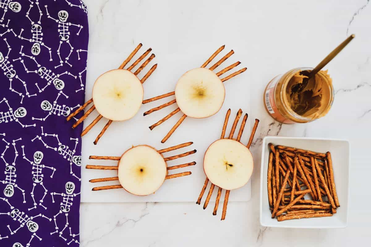 apple slices with peanut butter and pretzel sticks