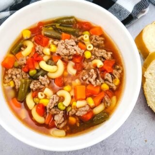 beef and macaroni soup in white bowl
