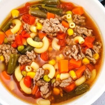 cropped beef and macaroni soup in white bowl 1