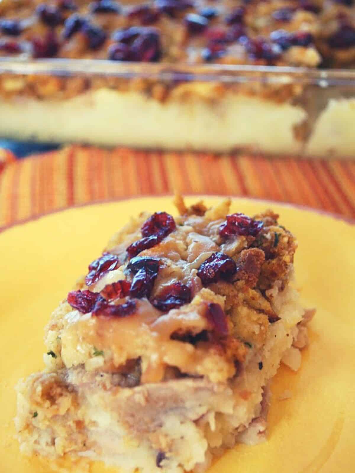 Thanksgiving dinner casserole on yellow plate